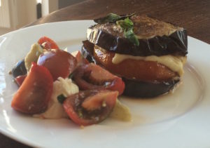 eggplant stack served with tomato salad